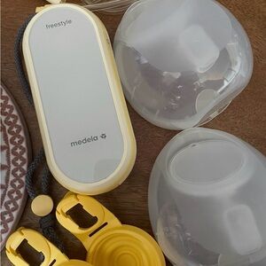 Medela Freestyle Portable Pump with Yellow Accents and White Panels